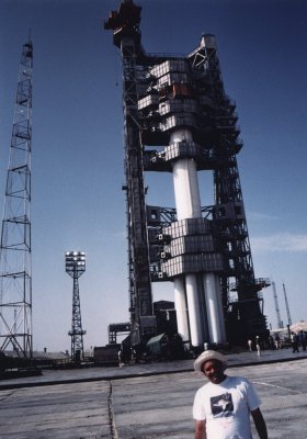 Ken Harman with Proton Rocket on pad in Baikonour